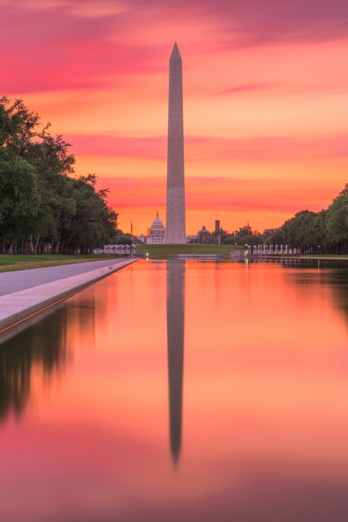 Washington Monument on the Reflecting Pool in Washington, DC at dawn.
